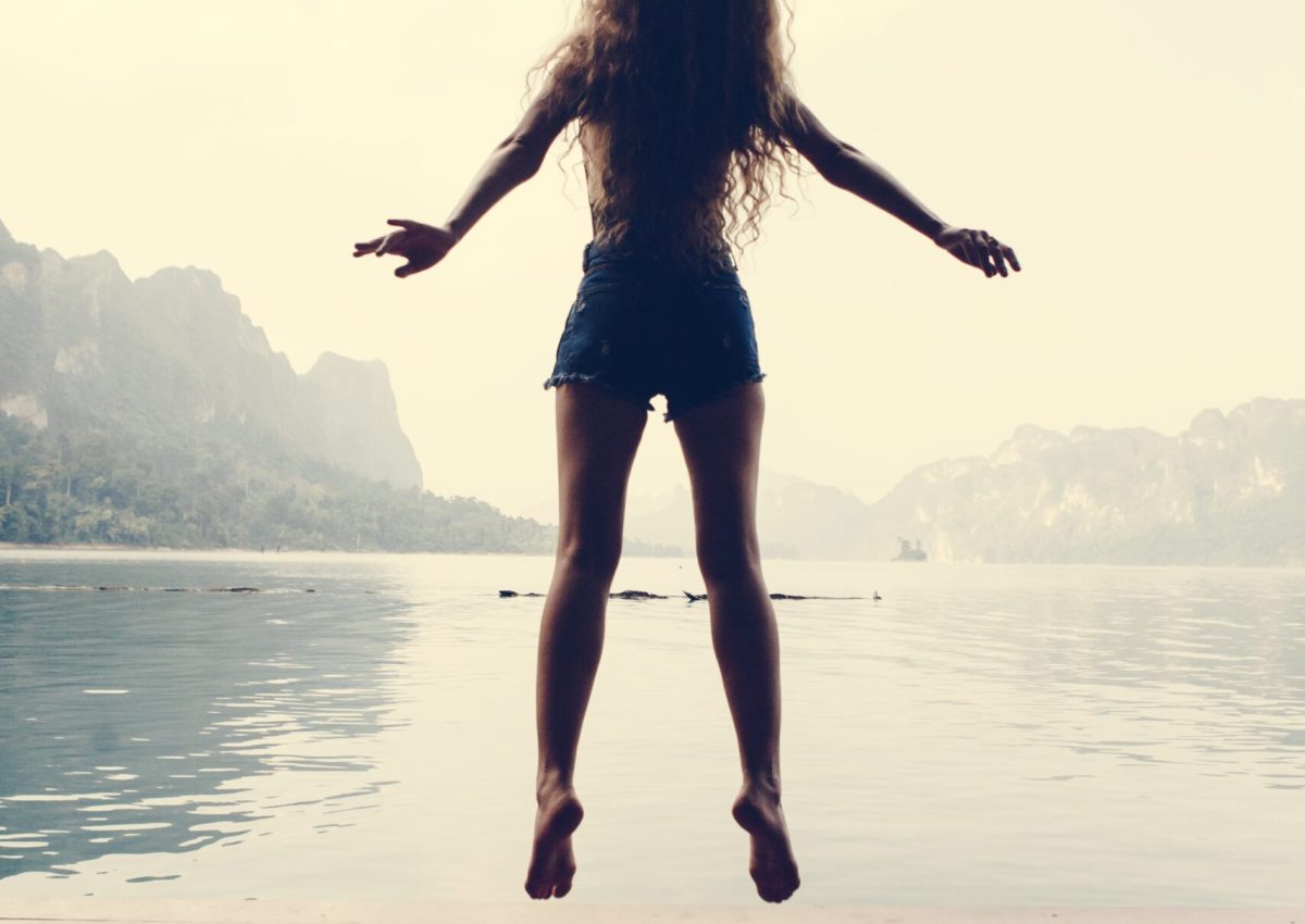 Happy woman jumping with joy